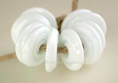 White Wavy Disk Spacer 10 wavy disks in white2 sizes available: 11-12 mm with 1.5 mm hole or 13-14 mm with 2.5 mm holeprice is per 10 disks 11-12 mm 1.5 mm hole,12-13 mm 2.5 mm hole