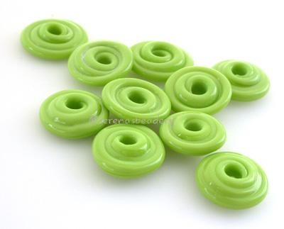 Pea Green Wavy Disk Spacer  10 wavy disks in pea green2 sizes available: 11-12 mm with 1.5 mm hole or 13-14 mm with 2.5 mm holeprice is per 10 disks 11-12 mm 1.5 mm hole,12-13 mm 2.5 mm hole