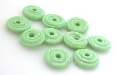 Mint Green Wavy Disk Spacer 10 wavy disks in mint green2 sizes available: 11-12 mm with 1.5 mm hole or 13-14 mm with 2.5 mm holeprice is per 10 disks 11-12 mm 1.5 mm hole,12-13 mm 2.5 mm hole