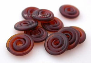 Dark Amber Tumbled Wavy Disk Spacer  10 tumbled wavy disks in dark amber2 sizes available: 11-12 mm with 1.5 mm hole or 13-14 mm with 2.5 mm holeprice is per 10 disks 11-12 mm 1.5 mm hole,12-13 mm 2.5 mm hole