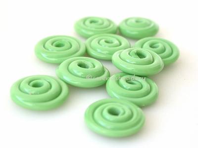 Nile Green Wavy Disk Spacer 10 wavy disks in nile green2 sizes available: 11-12 mm with 1.5 mm hole or 13-14 mm with 2.5 mm holeprice is per 10 disks 11-12 mm 1.5 mm hole,12-13 mm 2.5 mm hole