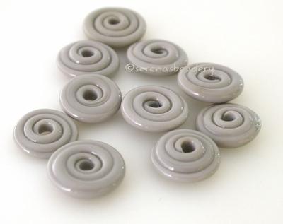 Opaque Light Grey Wavy Disk Spacer 10 wavy disks in opaque light grey2 sizes available: 11-12 mm with 1.5 mm hole or 13-14 mm with 2.5 mm holeprice is per 10 disks 11-12 mm 1.5 mm hole,12-13 mm 2.5 mm hole