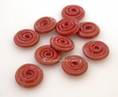 Cinnamon Coral Wavy Disk Spacer 10 wavy disks in cinnamon coral2 sizes available: 11-12 mm with 1.5 mm hole or 13-14 mm with 2.5 mm holeprice is per 10 disks 11-12 mm 1.5 mm hole,12-13 mm 2.5 mm hole