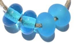 Light Aqua Color Notes: transparent light aqua 5x10 mm Available shapes and sizes:Round Bead Shapes: Available to order 8 to 15 mm with hole sizes ranging from 1.5 to 5 mm. See drop down menu for the exact options. Shown here in 8, 9 and 10 mm with both a 2.5 mm and 1.5 mm hole. 4 and 5 mm holes will fit European Charm style jewelry.Also available in a wavy disk or bead cap:. Pressed bead shapes:Lentil - 12x13 mm in size with a 1.5mm hole.: Pillow 13 mm square with a 1.5 mm hole.: Tab: Default Title