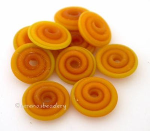 Yellow Ocher Matte Wavy Disk Spacer 10 wavy disks in yellow ocher with a matte finish2 sizes available: 11-12 mm with 1.5 mm hole or 13-14 mm with 2.5 mm holeprice is per 10 disks 11-12 mm 1.5 mm hole,12-13 mm 2.5 mm hole