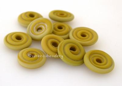 Wasabi Matte Wavy Disk Spacer 10 wavy disks in wasabi green with a matte finish2 sizes available: 11-12 mm with 1.5 mm hole or 13-14 mm with 2.5 mm holeprice is per 10 disks 11-12 mm 1.5 mm hole,12-13 mm 2.5 mm hole