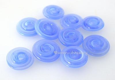Blue Lagoon Wavy Disk Spacer 10 wavy disks in blue lagoon2 sizes available: 11-12 mm with 1.5 mm hole or 13-14 mm with 2.5 mm holeprice is per 10 disks 11-12 mm 1.5 mm hole,12-13 mm 2.5 mm hole