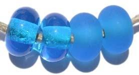 Dark Aqua Color Notes: transparent dark aqua 5x10 mm Available shapes and sizes:Round Bead Shapes: Available to order 8 to 15 mm with hole sizes ranging from 1.5 to 5 mm. See drop down menu for the exact options. Shown here in 8, 9 and 10 mm with both a 2.5 mm and 1.5 mm hole. 4 and 5 mm holes will fit European Charm style jewelry.Also available in a wavy disk or bead cap:. Pressed bead shapes:Lentil - 12x13 mm in size with a 1.5mm hole.: Pillow 13 mm square with a 1.5 mm hole.: Tab: Default Title
