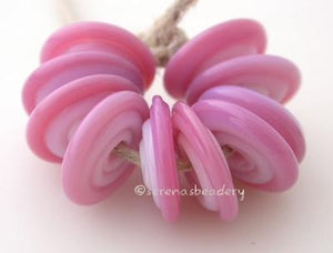Flower Pink Dark Wavy Disk Spacer 10 wavy disks in flower pink dark2 sizes available: 11-12 mm with 1.5 mm hole or 13-14 mm with 2.5 mm holeprice is per 10 disks 11-12 mm 1.5 mm hole,12-13 mm 2.5 mm hole