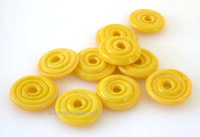 Sunshine Yellow Wavy Disk Spacer 10 wavy disks in sunshine yellow, an odd lot of glass2 sizes available: 11-12 mm with 1.5 mm hole or 13-14 mm with 2.5 mm holeprice is per 10 disks 11-12 mm 1.5 mm hole,12-13 mm 2.5 mm hole