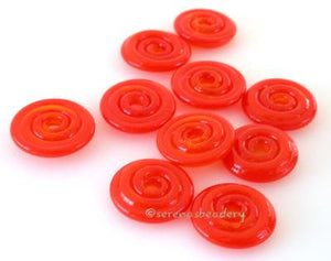 Red Carrot Sparkle Wavy Disk Spacer 10 wavy disks in red carrot, an odd lot of glass with glitter2 sizes available: 11-12 mm with 1.5 mm hole or 13-14 mm with 2.5 mm holeprice is per 10 disks 11-12 mm 1.5 mm hole,12-13 mm 2.5 mm hole