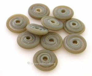 Lichen Matte Wavy Disk Spacer 10 wavy disks in lichen, an odd lot of glass in a matte finish2 sizes available: 11-12 mm with 1.5 mm hole or 13-14 mm with 2.5 mm holeprice is per 10 disks 11-12 mm 1.5 mm hole,12-13 mm 2.5 mm hole
