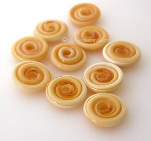 Honey Crunch Wavy Disk Spacer 10 wavy disks in honey crunch, an odd lot of glass2 sizes available: 11-12 mm with 1.5 mm hole or 13-14 mm with 2.5 mm holeprice is per 10 disks 11-12 mm 1.5 mm hole,12-13 mm 2.5 mm hole