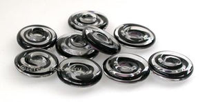 Black Ribbon Wavy Disk Spacer 10 wavy disks in black ribbon2 sizes available: 11-12 mm with 1.5 mm hole or 13-14 mm with 2.5 mm holeprice is per 10 disks 11-12 mm 1.5 mm hole,12-13 mm 2.5 mm hole