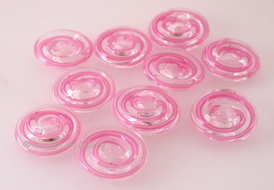 Pink Ribbon Wavy Disk Spacer 10 wavy disks in pink ribbon2 sizes available: 11-12 mm with 1.5 mm hole or 13-14 mm with 2.5 mm holeprice is per 10 disks 11-12 mm 1.5 mm hole,12-13 mm 2.5 mm hole