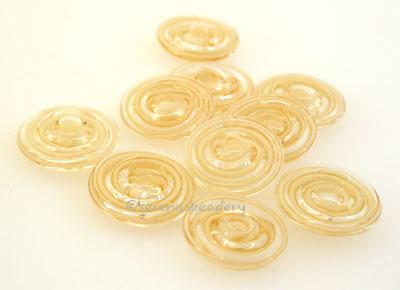 Ivory Ribbon Wavy Disk Spacer 10 wavy disks in ivory ribbon2 sizes available: 11-12 mm with 1.5 mm hole or 13-14 mm with 2.5 mm holeprice is per 10 disks 11-12 mm 1.5 mm hole,12-13 mm 2.5 mm hole