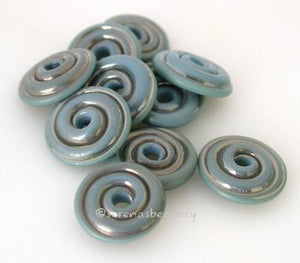 Sterling Blue Tumbled Wavy Disk Spacer 10 tumbled wavy disks in sterling blue, a special production color2 sizes available: 11-12 mm with 1.5 mm hole or 13-14 mm with 2.5 mm holeprice is per 10 disks 11-12 mm 1.5 mm hole,12-13 mm 2.5 mm hole