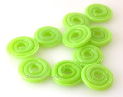Neon Spring Green Wavy Disk Spacer 10 wavy disks in neon spring green2 sizes available: 11-12 mm with 1.5 mm hole or 13-14 mm with 2.5 mm holeprice is per 10 disks 11-12 mm 1.5 mm hole,12-13 mm 2.5 mm hole