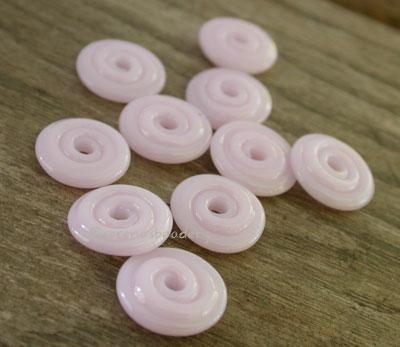 Petal Pink Wavy Disk Spacer 10 wavy disks in petal pink2 sizes available: 11-12 mm with 1.5 mm hole or 13-14 mm with 2.5 mm holeprice is per 10 disks 11-12 mm 1.5 mm hole,12-13 mm 2.5 mm hole