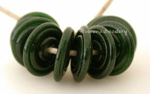 Aventurine Green Wavy Disk Spacer 10 wavy disks in aventurine green glitter2 sizes available: 11-12 mm with 1.5 mm hole or 13-14 mm with 2.5 mm holeprice is per 10 disks 11-12 mm 1.5 mm hole,12-13 mm 2.5 mm hole
