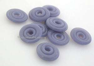 Lavender Blue Wavy Disk Spacer 10 wavy disks in lavender blue, a special production color2 sizes available: 11-12 mm with 1.5 mm hole or 13-14 mm with 2.5 mm holeprice is per 10 disks 11-12 mm 1.5 mm hole,12-13 mm 2.5 mm hole