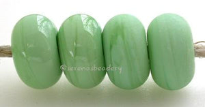 Mint Green Color Notes: a pale mint green shade 5x10 mm Available shapes and sizes:Round Bead Shapes: Available to order 8 to 15 mm with hole sizes ranging from 1.5 to 5 mm. See drop down menu for the exact options. Shown here in 8, 9 and 10 mm with both a 2.5 mm and 1.5 mm hole. 4 and 5 mm holes will fit European Charm style jewelry.Also available in a wavy disk or bead cap:. Pressed bead shapes:Lentil - 12x13 mm in size with a 1.5mm hole.: Pillow 13 mm square with a 1.5 mm hole.: Tab: Default Title