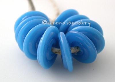 Electric Blue Wavy Disk Spacer 10 wavy disks in electric blue2 sizes available: 11-12 mm with 1.5 mm hole or 13-14 mm with 2.5 mm holeprice is per 10 disks 11-12 mm 1.5 mm hole,12-13 mm 2.5 mm hole