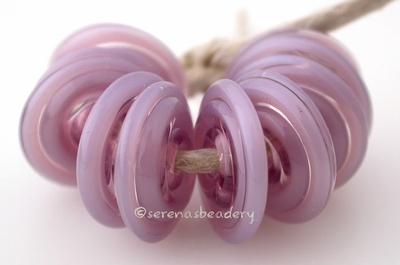Pearl Violet Wavy Disk Spacer 10 wavy disks in pearl violet2 sizes available: 11-12 mm with 1.5 mm hole or 13-14 mm with 2.5 mm holeprice is per 10 disks 11-12 mm 1.5 mm hole,12-13 mm 2.5 mm hole