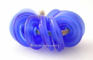 Mystic Blue Wavy Disk Spacer 10 wavy disks in mystic blue2 sizes available: 11-12 mm with 1.5 mm hole or 13-14 mm with 2.5 mm holeprice is per 10 disks 11-12 mm 1.5 mm hole,12-13 mm 2.5 mm hole