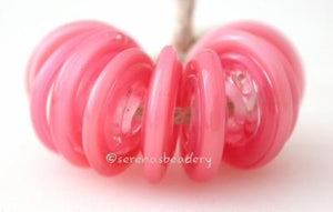 Pearl Pink Wavy Disk Spacer 10 wavy disks in pearl pink2 sizes available: 11-12 mm with 1.5 mm hole or 13-14 mm with 2.5 mm holeprice is per 10 disks 11-12 mm 1.5 mm hole,12-13 mm 2.5 mm hole
