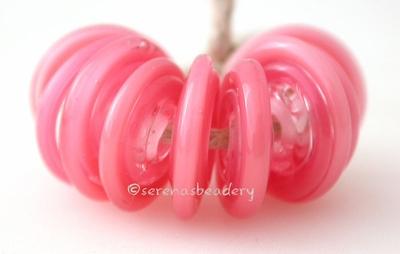 Pearl Pink Wavy Disk Spacer 10 wavy disks in pearl pink2 sizes available: 11-12 mm with 1.5 mm hole or 13-14 mm with 2.5 mm holeprice is per 10 disks 11-12 mm 1.5 mm hole,12-13 mm 2.5 mm hole