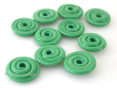Dark Grass Green Opaque Wavy Disk Spacer  10 wavy disks in dark grass green2 sizes available: 11-12 mm with 1.5 mm hole or 13-14 mm with 2.5 mm holeprice is per 10 disks 11-12 mm 1.5 mm hole,12-13 mm 2.5 mm hole