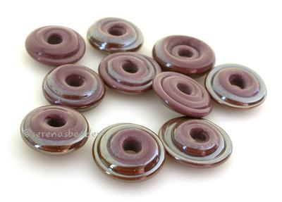 Dark Violet Wavy Disk Spacer 10 wavy disks in dark violet2 sizes available: 11-12 mm with 1.5 mm hole or 13-14 mm with 2.5 mm holeprice is per 10 disks 11-12 mm 1.5 mm hole,12-13 mm 2.5 mm hole