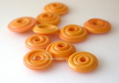 Squash Orange Wavy Disk Spacer 10 wavy disks in squash orange2 sizes available: 11-12 mm with 1.5 mm hole or 13-14 mm with 2.5 mm holeprice is per 10 disks 11-12 mm 1.5 mm hole,12-13 mm 2.5 mm hole