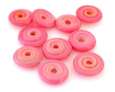 Poppy Wavy Disk Spacer 10 wavy disks in poppy, an odd lot of glass2 sizes available: 11-12 mm with 1.5 mm hole or 13-14 mm with 2.5 mm holeprice is per 10 disks 11-12 mm 1.5 mm hole,12-13 mm 2.5 mm hole