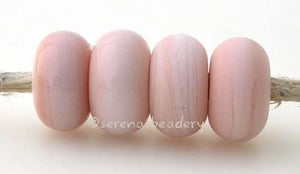 Tongue Pink Color Notes: Very pale pink that is finicky--not always an even color all around the bead 5x10 mm Available shapes and sizes:Round Bead Shapes: Available to order 8 to 15 mm with hole sizes ranging from 1.5 to 5 mm. See drop down menu for the exact options. Shown here in 8, 9 and 10 mm with both a 2.5 mm and 1.5 mm hole. 4 and 5 mm holes will fit European Charm style jewelry.Also available in a wavy disk or bead cap:. Pressed bead shapes:Lentil - 12x13 mm in size with a 1.5mm hole.: Pillow 13 mm