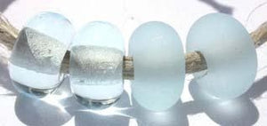 Pale Aqua Color Notes: very pale, looks great etched 5x10 mm Available shapes and sizes:Round Bead Shapes: Available to order 8 to 15 mm with hole sizes ranging from 1.5 to 5 mm. See drop down menu for the exact options. Shown here in 8, 9 and 10 mm with both a 2.5 mm and 1.5 mm hole. 4 and 5 mm holes will fit European Charm style jewelry.Also available in a wavy disk or bead cap:. Pressed bead shapes:Lentil - 12x13 mm in size with a 1.5mm hole.: Pillow 13 mm square with a 1.5 mm hole.: Tab: Default Title