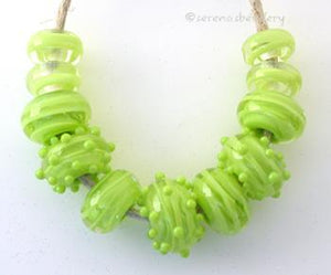 Double Pea Green Ribbon Spirals a set of pea green cased with pea green ribbon spirals, plus some dots!6x12 mm Default Title