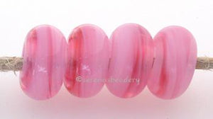 Pink Extravaganza Color Notes: an oddlot color that is no longer in production - once its gone, there will be no more 5x10 mm Available shapes and sizes:Round Bead Shapes: Available to order 8 to 15 mm with hole sizes ranging from 1.5 to 5 mm. See drop down menu for the exact options. Shown here in 8, 9 and 10 mm with both a 2.5 mm and 1.5 mm hole. 4 and 5 mm holes will fit European Charm style jewelry.Also available in a wavy disk or bead cap:. Pressed bead shapes:Lentil - 12x13 mm in size with a 1.5mm hol