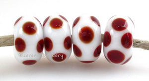 White Red Dice Dots #2116 A white base with deep red dice dots. 5x11 mm 4 beads This set is ready to ship. Default Title