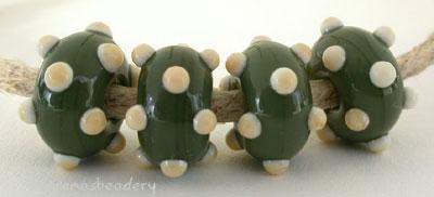 Olive Ivory Dots Olive beads with ivory dots. 6x11 mm price is per bead Glossy,Matte