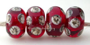 Transparent Red Silvered Ivory Dice A transparent red base with silvered ivory dice dots. 5x11 mm price is per bead Glossy,Matte