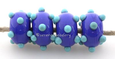 Cobalt Turquoise Raised Dice Dots A cobalt base with raised turquoise dice dots. 5x11 mm price is per bead Glossy,No,Glossy,Yes,Matte,No,Matte,Yes