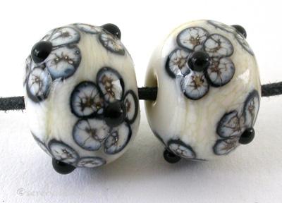 Silvered Ivory and Black Flowers a pair of ivory beads with black and silvered ivory flowers 6x12 mm 1.5 mm hole   Glossy,Matte