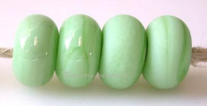Opaque Mint Color Notes: an oddlot color that is no longer in production - once its gone, there will be no more 5x10 mm Available shapes and sizes:Round Bead Shapes: Available to order 8 to 15 mm with hole sizes ranging from 1.5 to 5 mm. See drop down menu for the exact options. Shown here in 8, 9 and 10 mm with both a 2.5 mm and 1.5 mm hole. 4 and 5 mm holes will fit European Charm style jewelry.Also available in a wavy disk or bead cap:. Pressed bead shapes:Lentil - 12x13 mm in size with a 1.5mm hole.: Pi