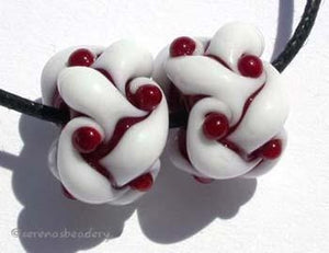 Deep Red and White Woven a pair of deep red and white woven beadsthe woven beads are a very intricate and unique design with lots of texture 7x13 mm Glossy,Matte