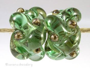 Pale Emerald Silvered Ivory Wovens a pair of wovens with silvered ivory as a base and matching dots - shown here in pale emerald greenThese woven beads are a very intricate and unique design with lots of texture. These are all one color for plenty of sparkle.7x13 mm Glossy,Matte