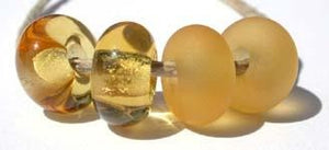 Yellow Color Notes: a very pale transparent topaz or amber color 5x10 mm Available shapes and sizes:Round Bead Shapes: Available to order 8 to 15 mm with hole sizes ranging from 1.5 to 5 mm. See drop down menu for the exact options. Shown here in 8, 9 and 10 mm with both a 2.5 mm and 1.5 mm hole. 4 and 5 mm holes will fit European Charm style jewelry.Also available in a wavy disk or bead cap:. Pressed bead shapes:Lentil - 12x13 mm in size with a 1.5mm hole.: Pillow 13 mm square with a 1.5 mm hole.: Tab: Def