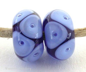 Cobalt Perwinkle Bubbles transparent cobalt and periwinkle offset bubbles 7x12 mm 2.5mm hole price is per bead All of my lampwork glass beads are individually handmade using Effetre, Vetrofond, or Lauscha, Reichenbach, Double Helix, and Bullseye glass rods. They are annealed in a digitally controlled kiln for everlasting strength and durability. Default Title