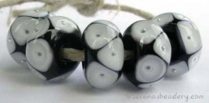 Black and White Bubbles black and white bubble encased beads 7x12 mm 2.5mm hole price is per bead All of my lampwork glass beads are individually handmade using Effetre, Vetrofond, or Lauscha, Reichenbach, Double Helix, and Bullseye glass rods. They are annealed in a digitally controlled kiln for everlasting strength and durability.   Default Title